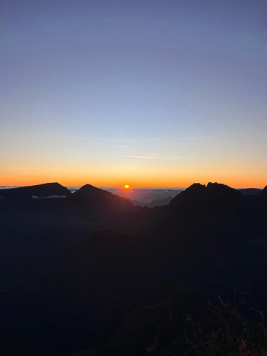 a sunset from the top of a mountain at Ferme l'Eau de Coco in Saint-Paul