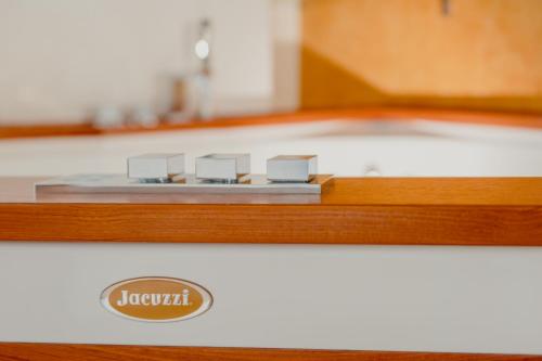a close up of a counter with a sign on it at Aphrodite Luxury APT with Jacuzzi in Trieste