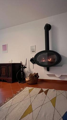 a fireplace in the corner of a living room at Garden Suite in Bolzano