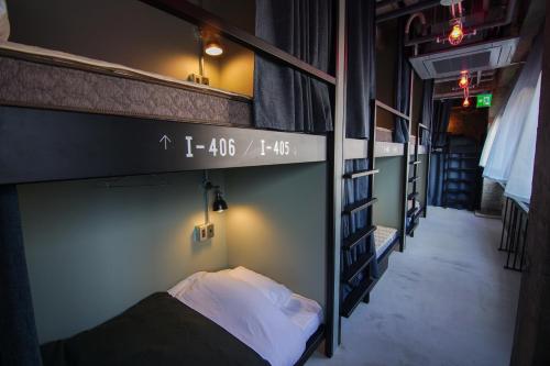a couple of bunk beds in a room at Red Submarine in Kure