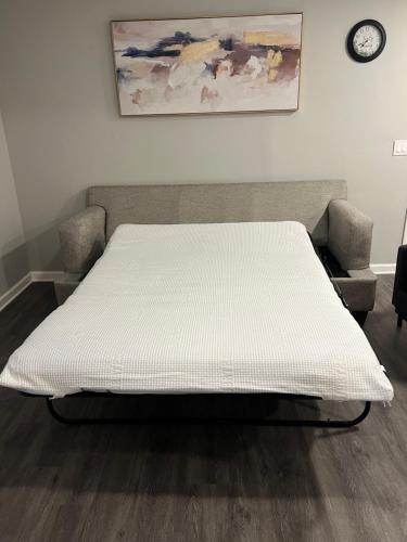 a bed in the corner of a room at The Central Crib in Kansas City