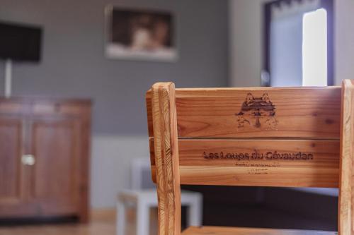 a close up of the back of a wooden chair at Village de gîtes de Sainte-Lucie in Sainte-Lucie