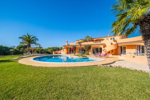 a house with a swimming pool in a yard at Villa Eagles Nest by Algarve Vacation in Albufeira
