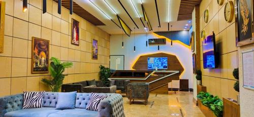 a living room with a couch and a pool table at FRT AİRPORT OTEL in Arnavutköy