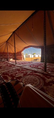 a large tent with a view of a field at Almansour farm in AlUla