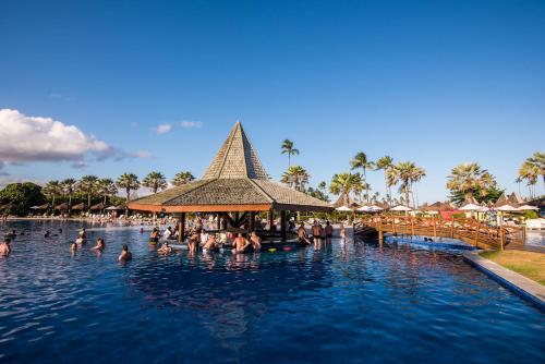 a group of people in a swimming pool at a resort at Vila Galé Resort Marés - All Inclusive in Guarajuba