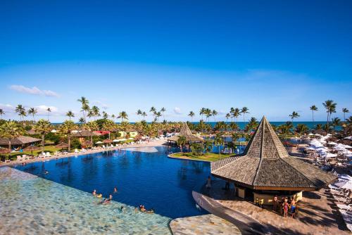 an aerial view of a swimming pool at a resort at Vila Galé Resort Marés - All Inclusive in Guarajuba