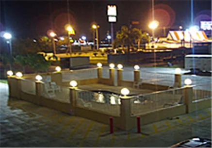 a bunch of lights in a parking lot at night at Texas Inn & Suites in La Joya