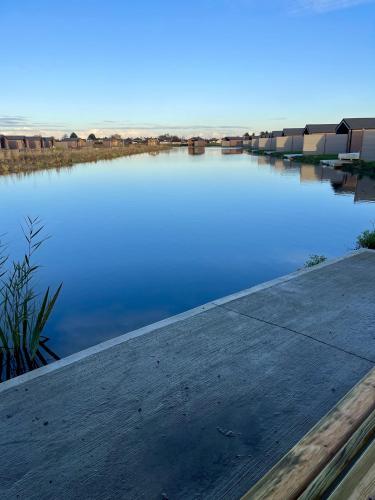 a large body of water with a dock at Lakeside Fishing Retreats in Boston
