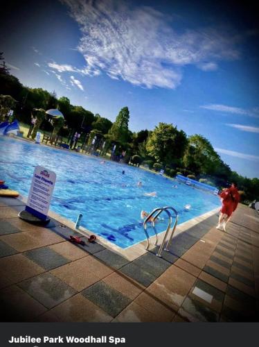 a swimming pool with a person in the water at Lakeside Fishing Retreats in Boston