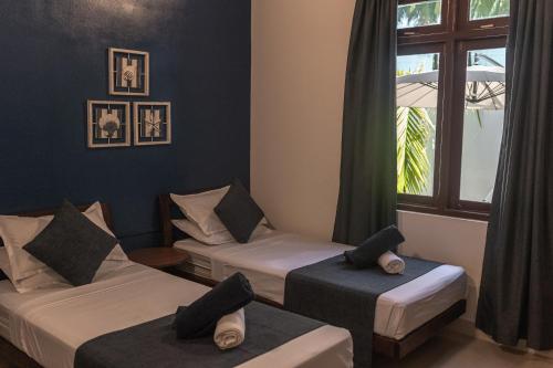 Postel nebo postele na pokoji v ubytování Captal Beach Villa