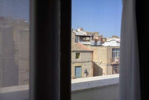 a view of a city from a window at Piccolo Torino Rooms in Canicattì