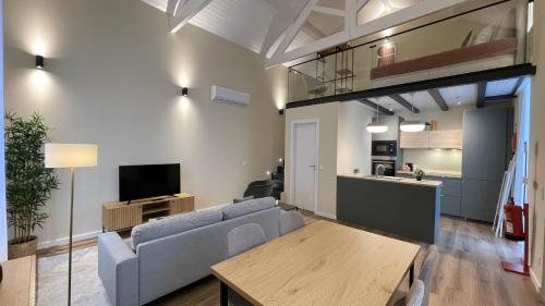 a living room with a couch and a table at MyTrip Porto in Matosinhos