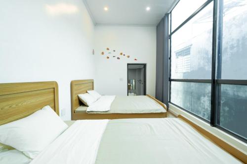 Giường trong phòng chung tại Cá Homestay-Cao Bằng