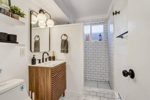 a bathroom with a sink and a shower at Brookside Mountain Modern Apartment / MTN views! in Colorado Springs