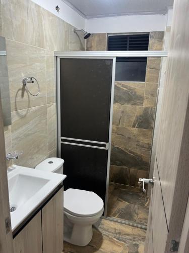 a bathroom with a toilet and a sink at Apartaestudio en la mesa in La Mesa