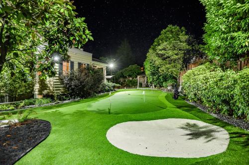 a golf course at night with a green at Vancouver Golf Villa - Private Oasis in Vancouver