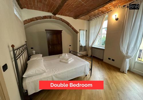 Postel nebo postele na pokoji v ubytování Appartamento con Vista sulla Via Principale