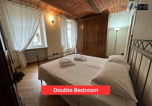 Postel nebo postele na pokoji v ubytování Appartamento con Vista sulla Via Principale