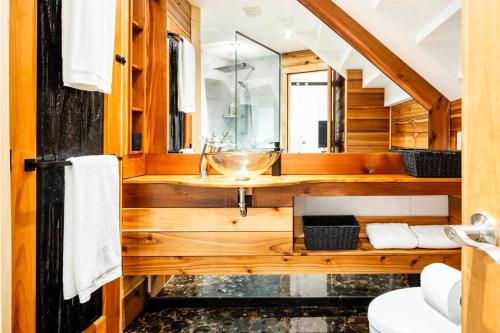 a bathroom with a sink and a mirror at MileEnd - Huge Bright & Modern Loft Suite - KingBed in Montréal