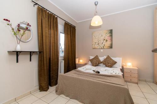 a bedroom with a bed and a window at Cristina Apartment 2 in Neos Marmaras