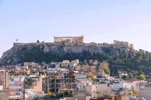 a view of the acropolis of athens from the city at PANORAMIC SUITE in Athens