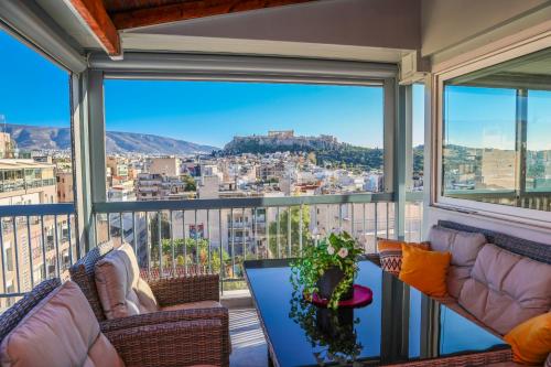 a living room with a view of a city at PANORAMIC SUITE in Athens