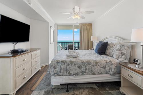 a bedroom with a bed with a view of the ocean at Ashworth 1809 in Myrtle Beach