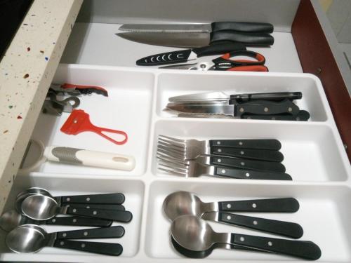 a drawer filled with lots of utensils at Apartamento Etxe Morea, Casco Histórico in Bermeo