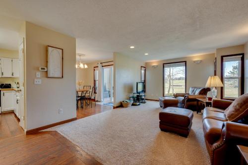 a living room with a couch and a table at Loveland Townhome Walkable to Lake and Park! in Loveland