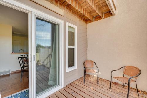 two chairs sitting on the porch of a house at Loveland Townhome Walkable to Lake and Park! in Loveland