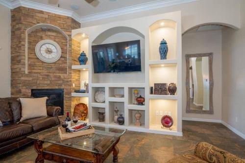 a living room with a couch and a fireplace at 4 bedroom gorgeous home Eastside El Paso in El Paso