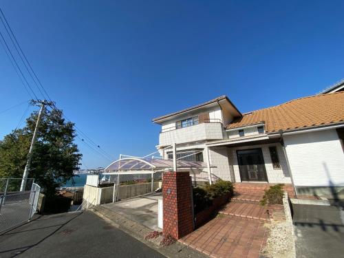 a house on the side of a street at Kashibesso Kiteki - Vacation STAY 26650v in Kitakyushu