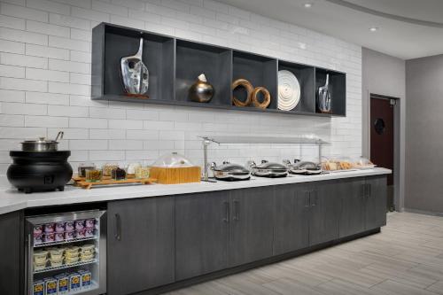 a kitchen with a counter with pots and pans at SpringHill Suites by Marriott Annapolis in Annapolis