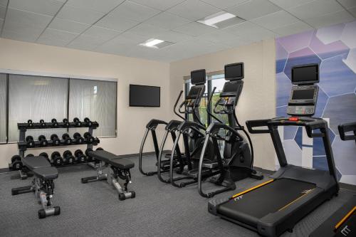 a gym with several treadmills and exercise bikes at SpringHill Suites by Marriott Annapolis in Annapolis