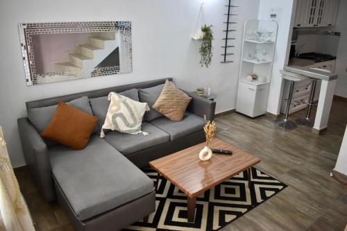 a living room with a couch and a table at Casa Colinas in Buenaventura