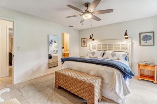 a bedroom with a bed and a ceiling fan at 3325 Fairway Oaks in Amelia Island