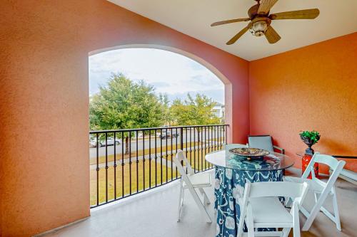 a dining room with a table and chairs on a balcony at Villa Christol in Bluffton