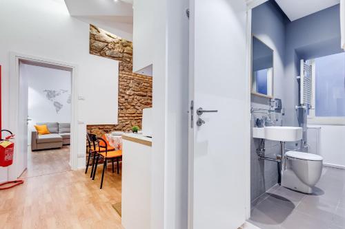 a bathroom with a sink and a toilet in a room at TRASTEVERE SUITE EXPERIENCE in Rome