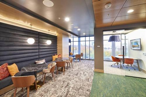 a lobby with tables and chairs in a building at Navy Nights & Scenic Feels - Sleek Studio Stay in Boise