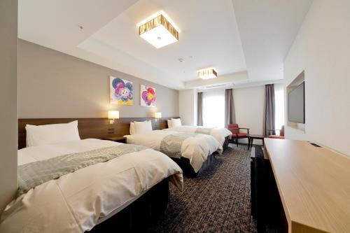 Tempat tidur dalam kamar di Hotel Gran Ms Kyoto