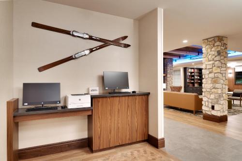 a hotel lobby with a room with a tv and a museum at Residence Inn by Marriott Vail in Vail