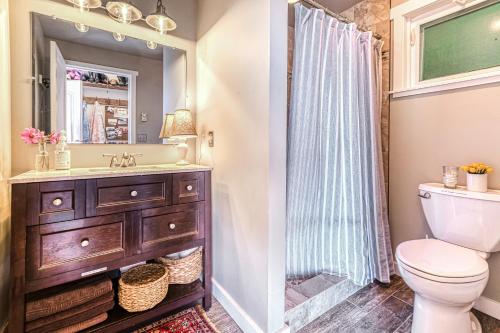 a bathroom with a sink and a toilet at Ferry Viewer Cottage in Point Roberts