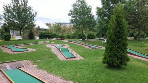 a group of trampolines in a park with a bunch of trays at Panorama Hotel Oberwiesenthal in Kurort Oberwiesenthal