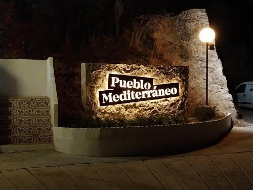 a sign for a mediterranean at Apartamentos Bon Amb in Faro de Cullera