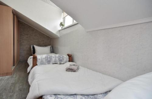 a bedroom with two beds and a window at Budva OLD TOWN 4 apartment in Budva