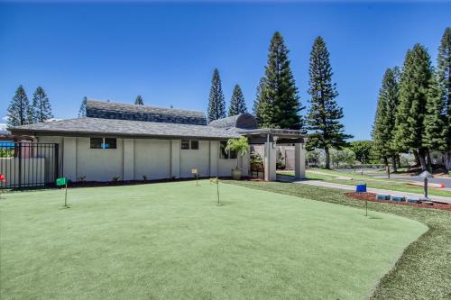 a house with a lawn with golf balls in it at Paniolo Greens at Waikoloa C212 in Waikoloa Village