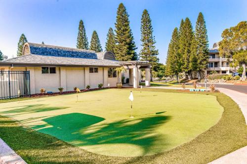 a golf course in front of a house at Paniolo Greens at Waikoloa C212 in Waikoloa Village