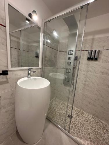 a bathroom with a shower and a toilet and a sink at La casa di Stella in Isernia