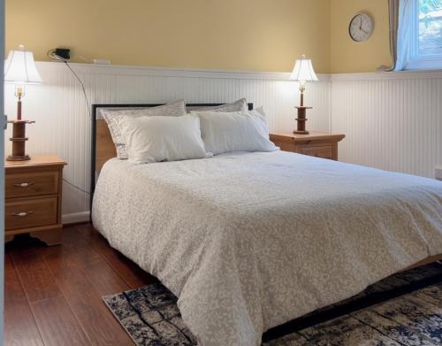 a bedroom with a large bed with two night stands at Cozy Condo in Wintergreen Resort That Sleeps 4! in Lyndhurst